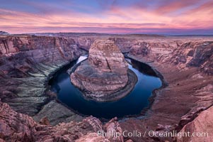 Spectacular Horseshoe Bend sunrise. The Colorado River makes a 180-degree turn at Horseshoe Bend. Here the river has eroded the Navajo sandstone for eons, digging a canyon 1100-feet deep, Page, Arizona