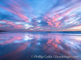 Spectacular Sunset, Terramar Beach, Carlsbad. Pink and Purple pastel hues are mirrored on the wet side as the tide retreats