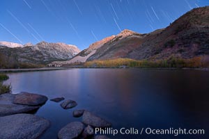 Star trails and alpenglow on the Sierra Nevada, Paiute Peak, before sunrise, reflected in North Lake in the Sierra Nevada, Bishop Creek Canyon Sierra Nevada Mountains