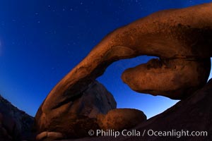 Star trails and Arch Rock. Polaris, the North Star, is at the center of the circular arc star trails as they pass above this natural stone archway in Joshua Tree National Park, Alabama Hills Recreational Area