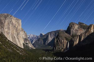 Star trails over Yosemite Valley, viewed from Tunnel View, the floor of Yosemite Valley illuminated by a full moon.  El Capitan on left, Bridalveil Falls on right, Half Dome in distant center.