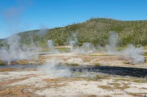 Steam rises above the Firehole River, Midway Geyser Basin, Yellowstone National Park, Wyoming