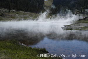 Steam rises from Firehole Lake, Lower Geyser Basin, Yellowstone National Park, Wyoming