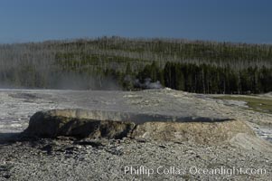 Steam rises from an unidentified geyser, Upper Geyser Basin, Yellowstone National Park, Wyoming