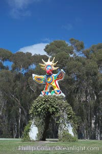 Image 12839, Sun God is a strange artwork, the first in the Stuart Collection at University of California San Diego (UCSD).  Commissioned in 1983 and produced by Niki de Sainte Phalle, Sun God has become a landmark on the UCSD campus. University of California, San Diego, La Jolla, USA, Phillip Colla, all rights reserved worldwide.   Keywords: architecture:art:california:campus:college:design:education:figure:la jolla:outdoors:outside:research:san diego:scene:school:statue:stuart collection:sun god:tourism:travel:ucsd:university:university of california:university of california san diego:usa.