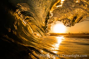 Sunrise breaking wave, dawn surf.