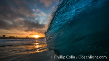 Sunrise breaking wave, dawn surf