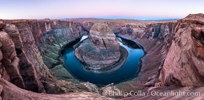 Predawn light on Horseshoe Bend. The Colorado River makes a 180-degree turn at Horseshoe Bend. Here the river has eroded the Navajo sandstone for eons, digging a canyon 1100-feet deep, Page, Arizona