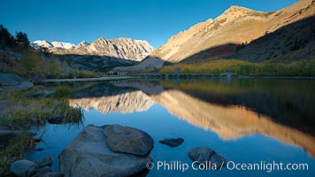 Sunrise on Paiute Peak, reflected in North Lake in the eastern Sierra Nevada, in autumn, Bishop Creek Canyon Sierra Nevada Mountains