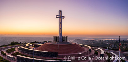 Sunrise over The Mount Soledad Cross, a landmark in La Jolla, California. The Mount Soledad Cross is a 29-foot-tall cross erected in 1954. Aerial photo.