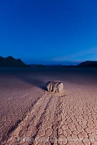 Sunrise on the Racetrack Playa. The sliding rocks, or sailing stones, move across the mud flats of the Racetrack Playa, leaving trails behind in the mud. The explanation for their movement is not known with certainty, but many believe wind pushes the rocks over wet and perhaps icy mud in winter, Death Valley National Park, California