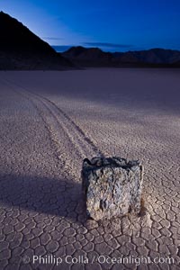 Sunrise on the Racetrack Playa. The sliding rocks, or sailing stones, move across the mud flats of the Racetrack Playa, leaving trails behind in the mud. The explanation for their movement is not known with certainty, but many believe wind pushes the rocks over wet and perhaps icy mud in winter, Death Valley National Park, California