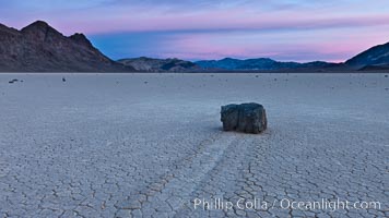 Sunrise on the Racetrack Playa. The sliding rocks, or sailing stones, move across the mud flats of the Racetrack Playa, leaving trails behind in the mud. The explanation for their movement is not known with certainty, but many believe wind pushes the rocks over wet and perhaps icy mud in winter, Death Valley National Park, California