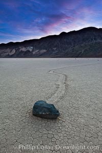 Sunrise on the Racetrack Playa. The sliding rocks, or sailing stones, move across the mud flats of the Racetrack Playa, leaving trails behind in the mud. The explanation for their movement is not known with certainty, but many believe wind pushes the rocks over wet and perhaps icy mud in winter, Death Valley National Park, California