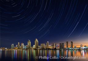 Approaching sunrise and star trails over the San Diego Downtown City Skyline.  In this 60 minute exposure, stars create trails through the night sky over downtown San Diego