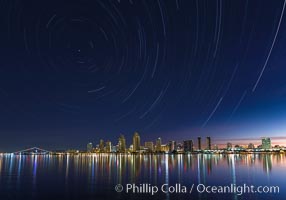 Approaching sunrise and star trails over the San Diego Downtown City Skyline.  In this 60 minute exposure, stars create trails through the night sky over downtown San Diego