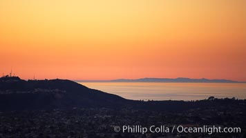 Mount Soledad juxtaposed against a distant San Clemente Island at sunset, San Diego, California