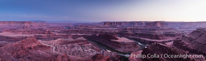 Sunset at Dead Horse Point Overlook, with the Colorado River flowing 2,000 feet below. 300 million years of erosion has carved the expansive canyons, cliffs and walls below and surrounding Deadhorse Point, Dead Horse Point State Park, Utah