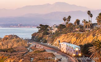 Sunset on the Del Mar Bluffs and Train Tracks, with North County coastline. The highest peaks in the distance are Santiago Peak and Modjeska Peak, the pair commonly known as Saddleback