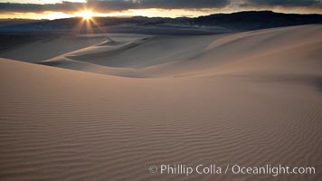 Sunset on the Eureka Dunes.  The Eureka Valley Sand Dunes are California's tallest sand dunes, and one of the tallest in the United States.  Rising 680' above the floor of the Eureka Valley, the Eureka sand dunes are home to several endangered species, as well as "singing sand" that makes strange sounds when it shifts.  Located in the remote northern portion of Death Valley National Park, the Eureka Dunes see very few visitors