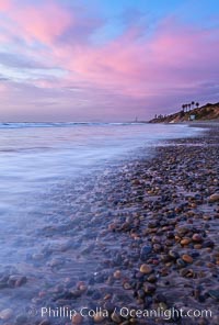 Sunset and incoming surf, gorgeous colors in the sky and on the ocean at dusk, the incoming waves are blurred in this long exposure, Carlsbad, California