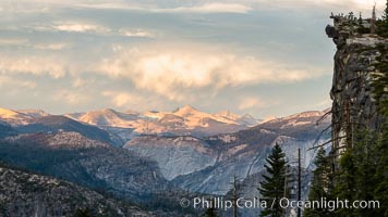 Sunset over the Yosemite High Country, people on the precipice at Glacier Point, Yosemite National Park