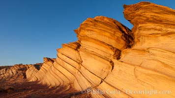 The Great Wall, Navajo Tribal Lands, Arizona. Sandstone "fins", eroded striations that depict how sandstone -- ancient compressed sand -- was laid down in layers over time.  Now exposed, the layer erode at different rates, forming delicate "fins" that stretch for long distances, Page