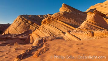 Sandstone "fins", eroded striations that depict how sandstone -- ancient compressed sand -- was laid down in layers over time.  Now exposed, the layer erode at different rates, forming delicate "fins" that stretch for long distances, Navajo Tribal Lands, Page, Arizona