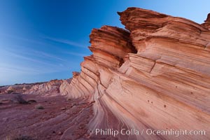 Sandstone "fins", eroded striations that depict how sandstone -- ancient compressed sand -- was laid down in layers over time.  Now exposed, the layer erode at different rates, forming delicate "fins" that stretch for long distances, Navajo Tribal Lands, Page, Arizona