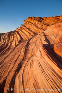 Sandstone "fins", eroded striations that depict how sandstone -- ancient compressed sand -- was laid down in layers over time.  Now exposed, the layer erode at different rates, forming delicate "fins" that stretch for long distances, Navajo Tribal Lands, Page, Arizona