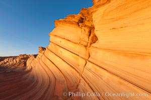 Sandstone "fins", eroded striations that depict how sandstone -- ancient compressed sand -- was laid down in layers over time.  Now exposed, the layer erode at different rates, forming delicate "fins" that stretch for long distances, Navajo Tribal Lands, Page, Arizona