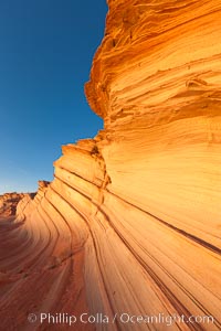 Sandstone "fins", eroded striations that depict how sandstone -- ancient compressed sand -- was laid down in layers over time.  Now exposed, the layer erode at different rates, forming delicate "fins" that stretch for long distances, Navajo Tribal Lands, Page, Arizona