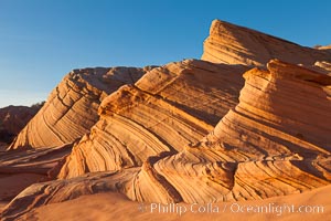 Sandstone "fins", eroded striations that depict how sandstone -- ancient compressed sand -- was laid down in layers over time.  Now exposed, the layer erode at different rates, forming delicate "fins" that stretch for long distances, Navajo Tribal Lands, Page, Arizona