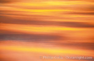 Clouds light up with blazing colors at sunset, La Jolla, California