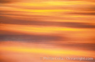 Clouds light up with blazing colors at sunset, La Jolla, California