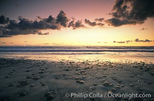 Sunset, cobblestones, surf and sand, Torrey Pines State Beach.