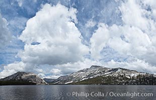 Tenaya Peak and Tenaya Lake lie below spring clouds in Yosemite National Park's high country. Yosemite National Park.