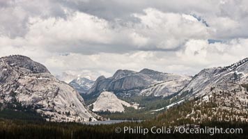 Tenaya Lake in Yosemite National Park's high country, with Pywiack Dome, Medlicott Dome and Mount Conness in the distance.