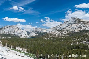 Tenaya Peak (right) rises above Tenaya Lake (left center) with granite domes rising above the northern banks of the lake, viewed from Olmsted Point, Yosemite National Park, California