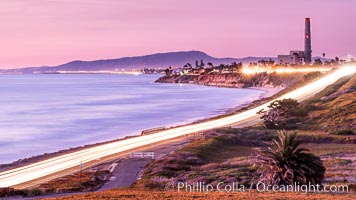 Sunset on Terra Mar and the Carlsbad coastline, looking north to Oceanside, Camp Pendleton and San Onofre.  The Oceanside Pier, lit up at night, is seen further up the coast. Rising in the distance is San Onofre Mountain (1722') topped by a tall signal tower, one of the southern peaks in the Santa Ana Mountains