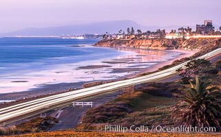 Carlsbad Coast Highway Sunset, from Terramar and North Ponto to Oceanside and Camp Pendleton. The smoke stack that marked the old Encina Power Plant was removed in 2021. Oceanside Pier is seen beautifully lit in the distance. Rising in the distance is San Onofre Mountain (1722') topped by a tall signal tower, one of the southern peaks in the Santa Ana Mountains