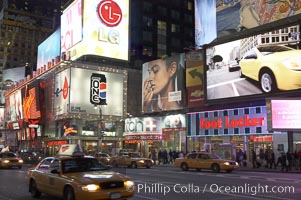 Neon lights fill Times Square at night, New York City