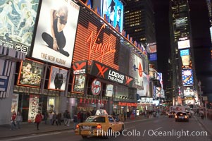 Neon lights fill Times Square at night, New York City