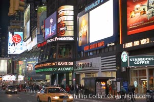Neon lights fill Times Square at night, New York City