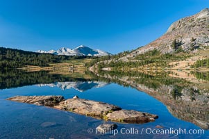 Sunrise reflections in Tioga Lake. This spectacular location is just a short walk from the Tioga Pass road. Near Tuolumne Meadows and Yosemite National Park