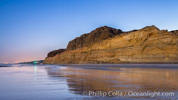 Torrey Pines Cliffs lit at night by a full moon, low tide reflections, Torrey Pines State Reserve, San Diego, California