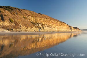 Sandstone cliffs rise above the beach at Torrey Pines State Reserve, San Diego, California