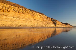 Sandstone cliffs rise above the beach at Torrey Pines State Reserve, San Diego, California