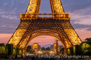 The Eiffel Tower with the Trocodero seen in the distance across the Seine, Paris, France. The Eiffel Tower is an iron lattice tower located on the Champ de Mars in Paris, named after the engineer Gustave Eiffel, who designed the tower in 1889 as the entrance arch to the 1889 World's Fair. The Eiffel tower is the tallest structure in Paris and the most-visited paid monument in the world, Tour Eiffel