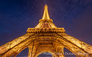 La Tour Eiffel. The Eiffel Tower is an iron lattice tower located on the Champ de Mars in Paris, named after the engineer Gustave Eiffel, who designed the tower in 1889 as the entrance arch to the 1889 World's Fair. The Eiffel tower is the tallest structure in Paris and the most-visited paid monument in the world